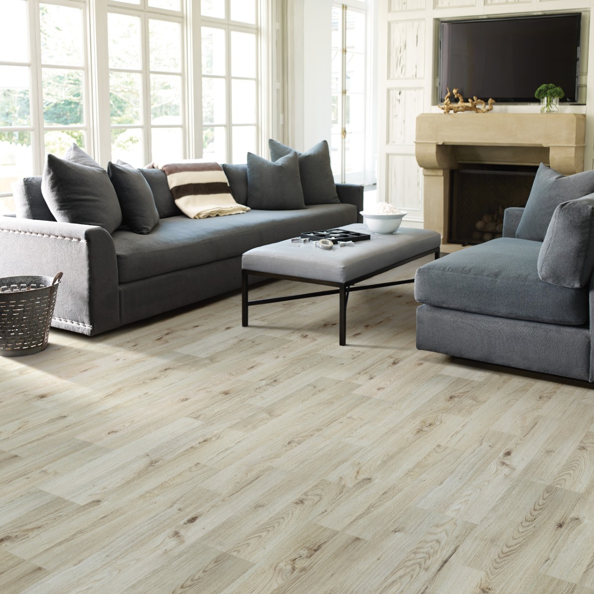Gray-toned white oak laminate flooring with modern hardwood look for pet-proof laminate flooring installation.